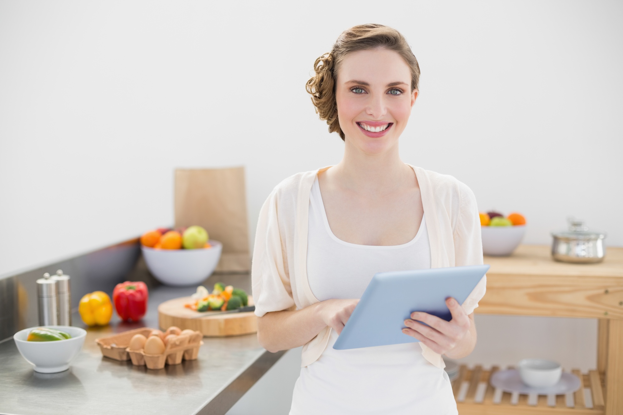 Student following online cooking class on tablet